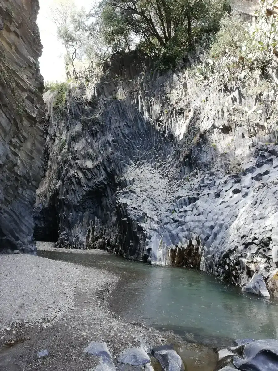 Basalt columns and the Alcantara river inside the gorge, paired with Mount Etna on tours from Taormina, Sicily